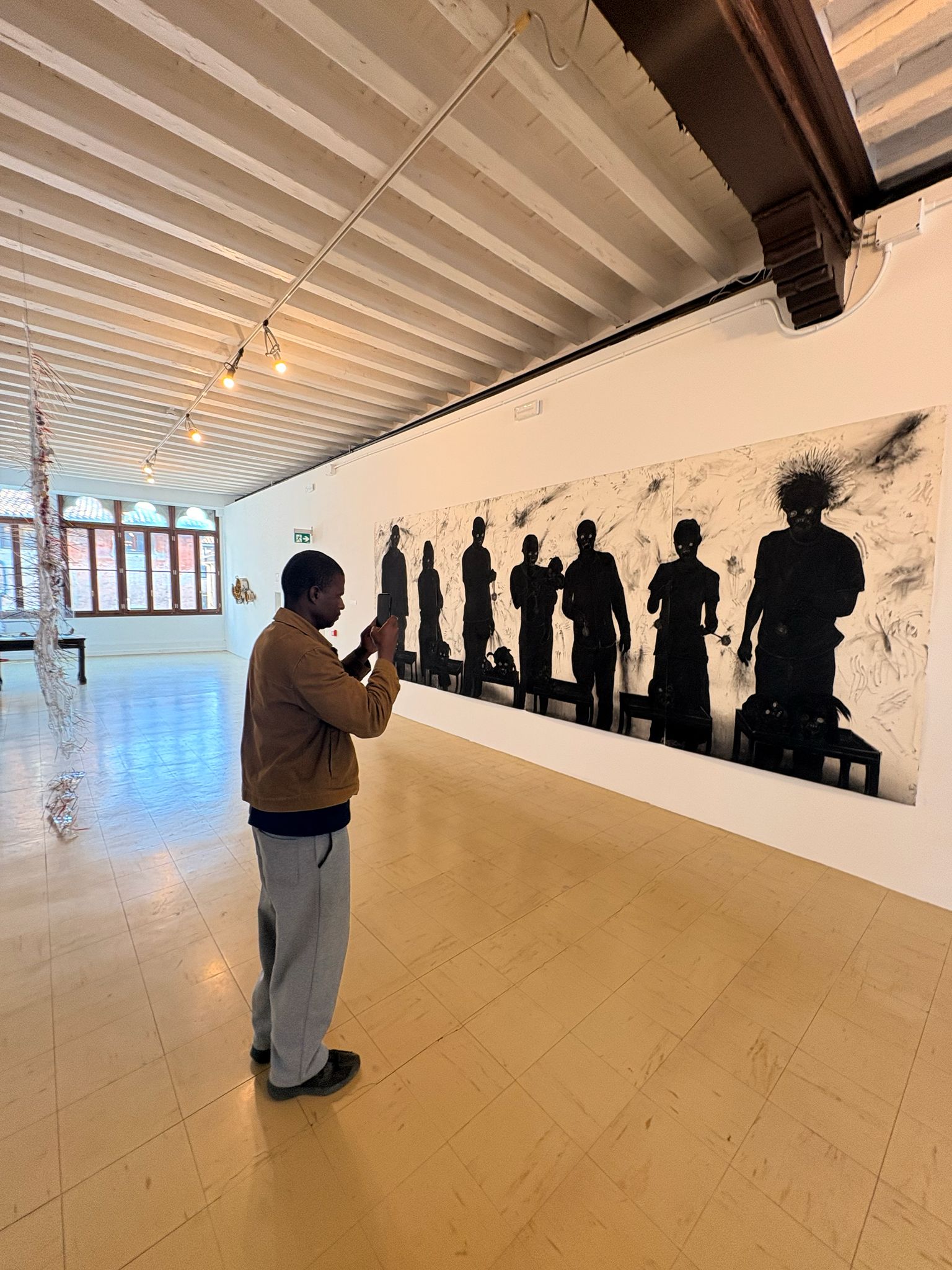 Felix Shumba taking final installation pictures